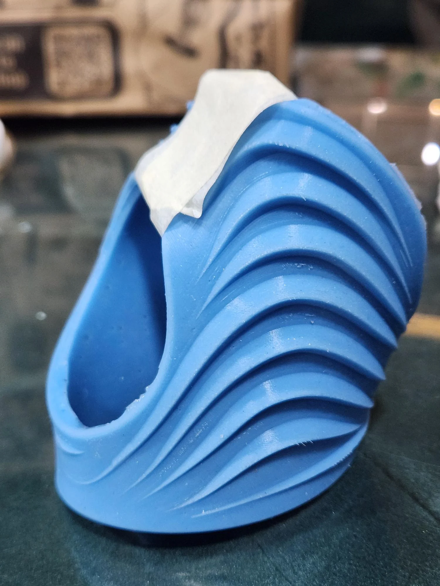 Blue wrapped prototype showing the back-of-hand ridges