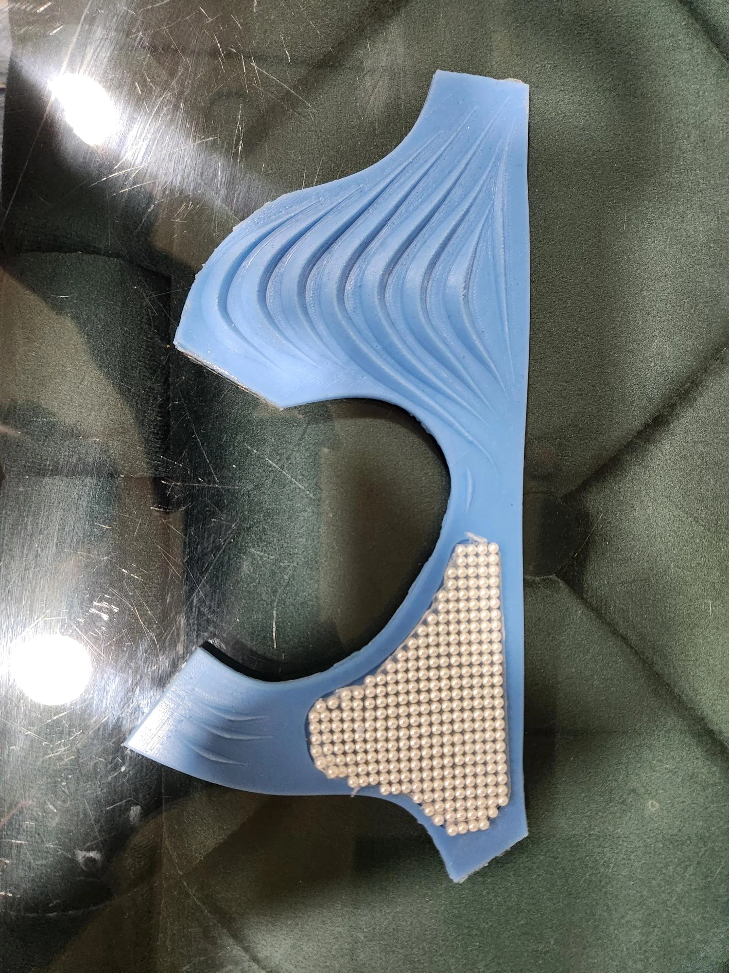Blue flat prototype showing wave ridges and palm beads